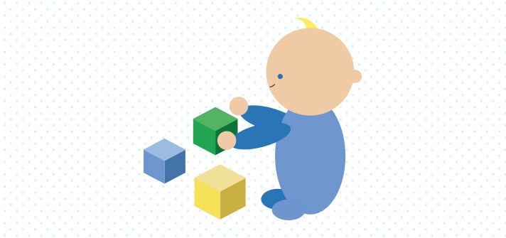 Baby playing with and stacking blocks