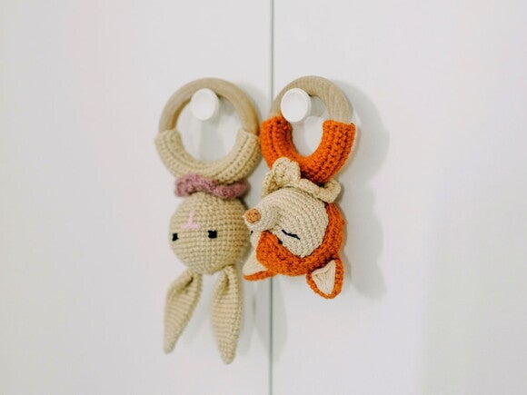 Baby wooden teething toy rabbit and fox hanging on hooks