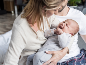 mother holding crying baby