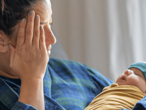 mum with baby looks tired