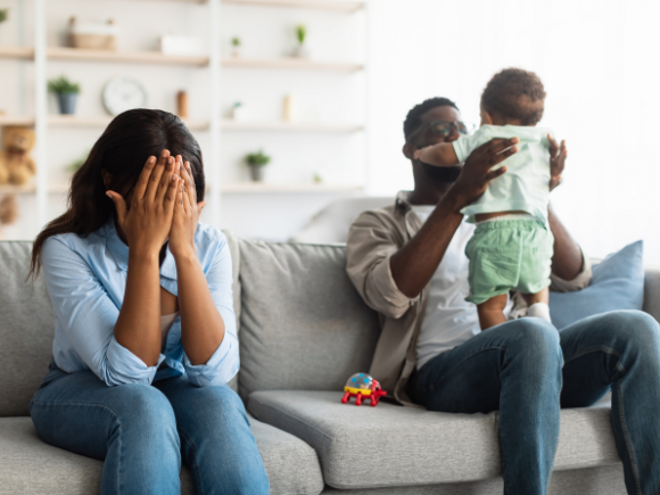 mother upset on the lounge with father and son next to her