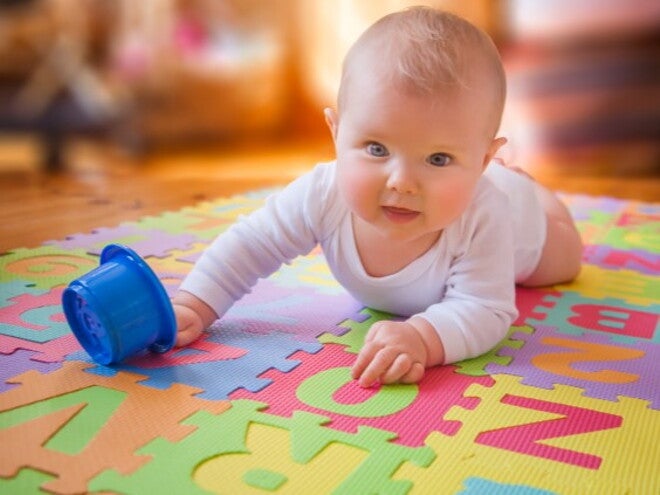 Baby lying on stomach doing tummy time