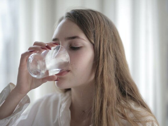 Woman drinking water from a glass