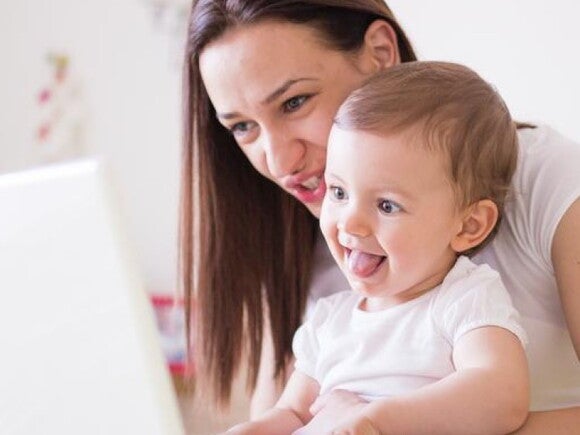 mother and child looking at a computer