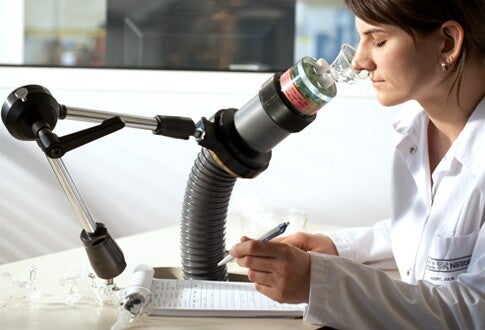 lady looking through microscope