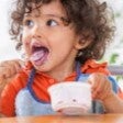 toddler eating yoghurt
